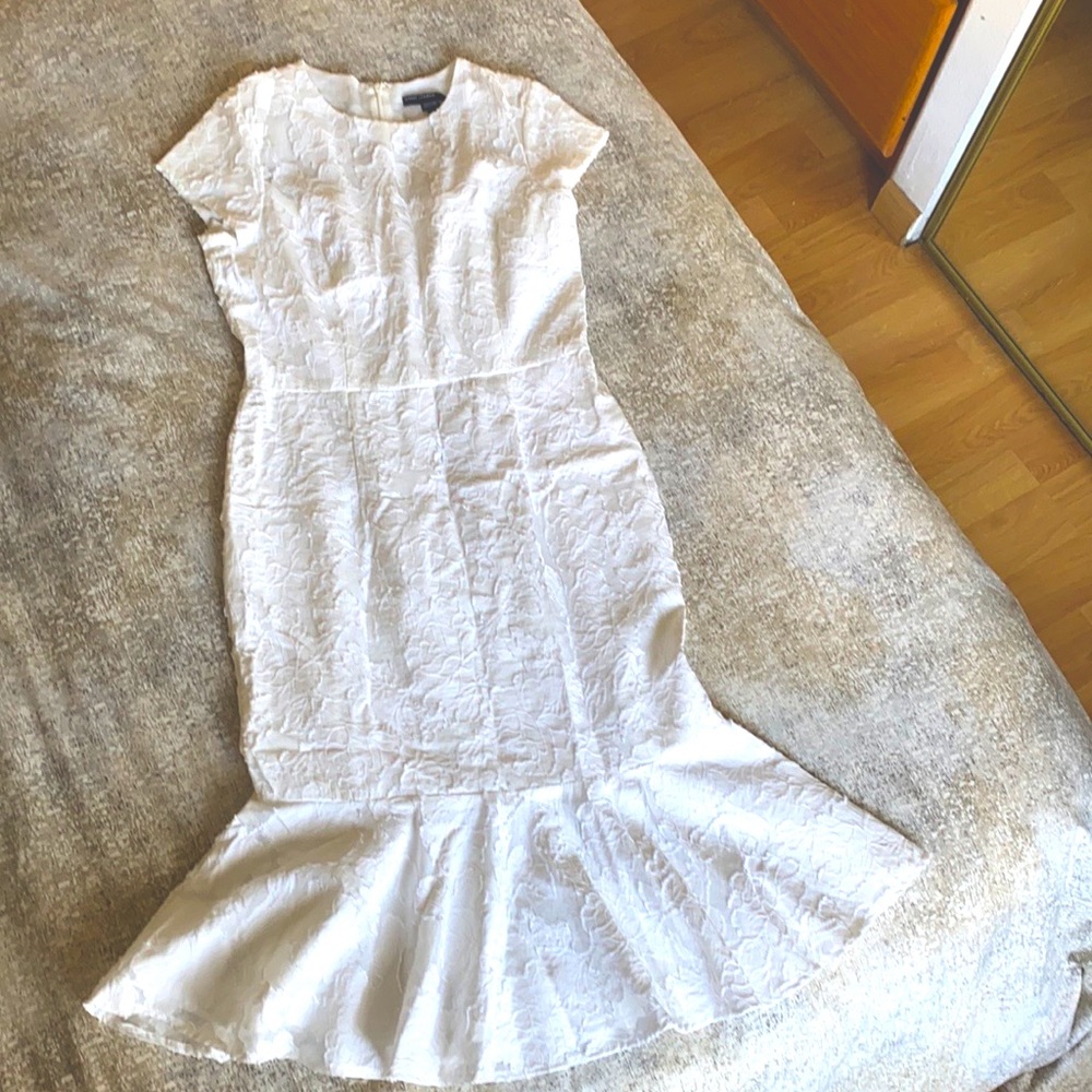 Maggy London white midi dress. Lace like details. Gorgeous dress.